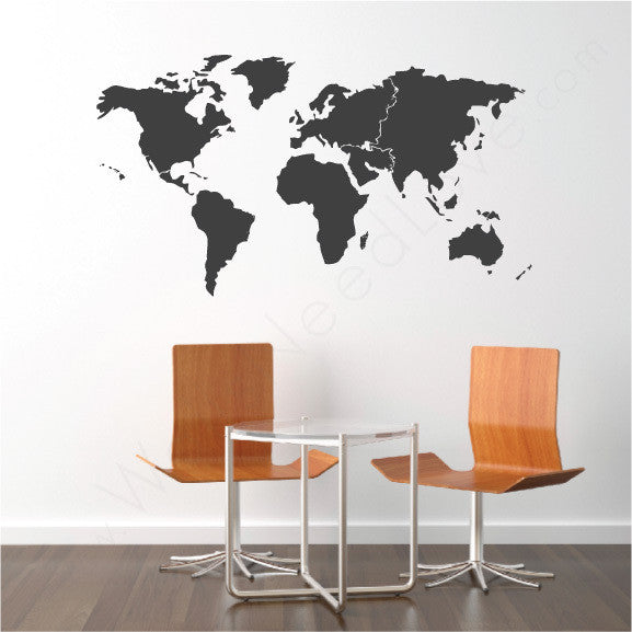 World Map Mount wall decal on wall behind chair | lifestyle
