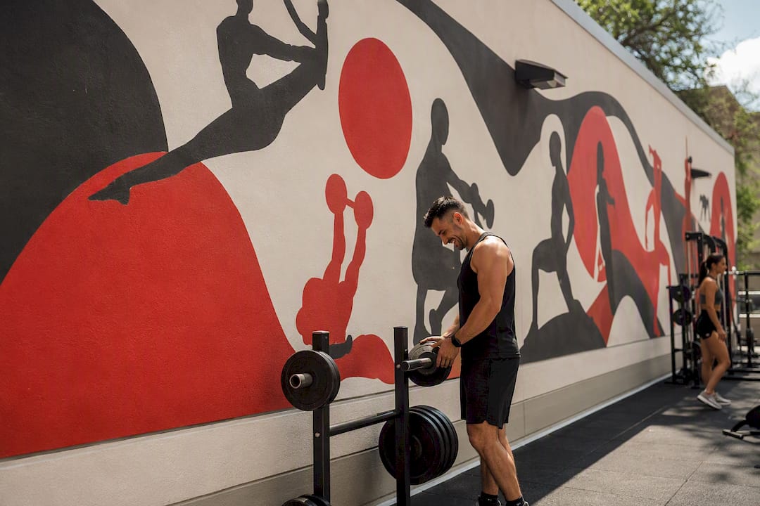 Large fitness mural in modern gym interior