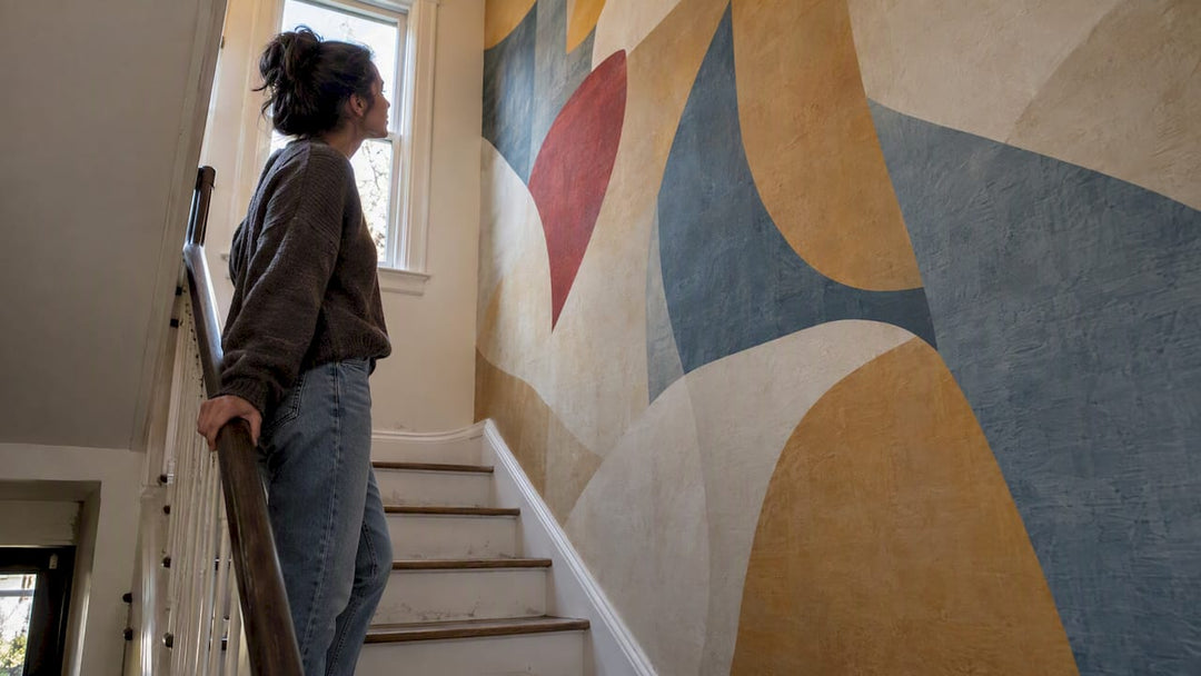 Abstract mural covering a townhouse stairwell wall