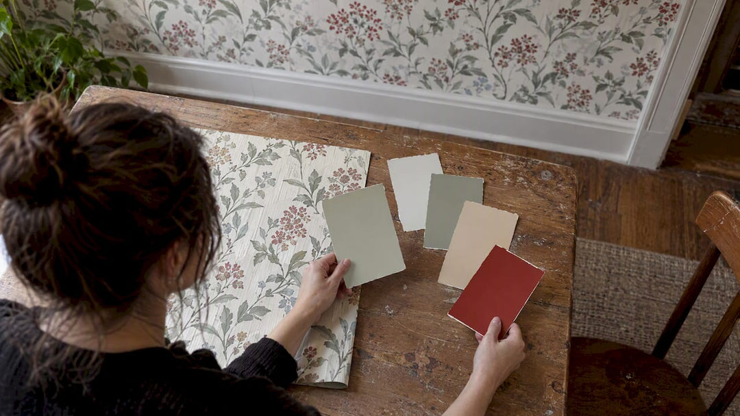 Paint swatches beside a patterned wallpaper sample